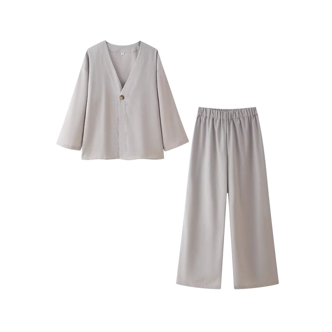 Ladies outfit consisting of an elegant V-neck blouse and wide palazzo pants Lune London