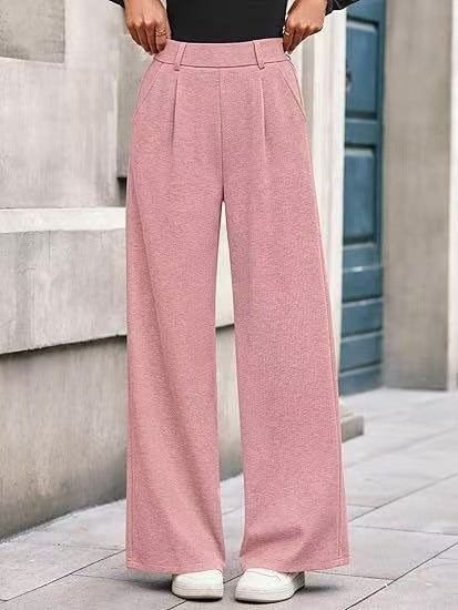 Loose fabric trousers for women with high waist and practical pockets. Chic and style