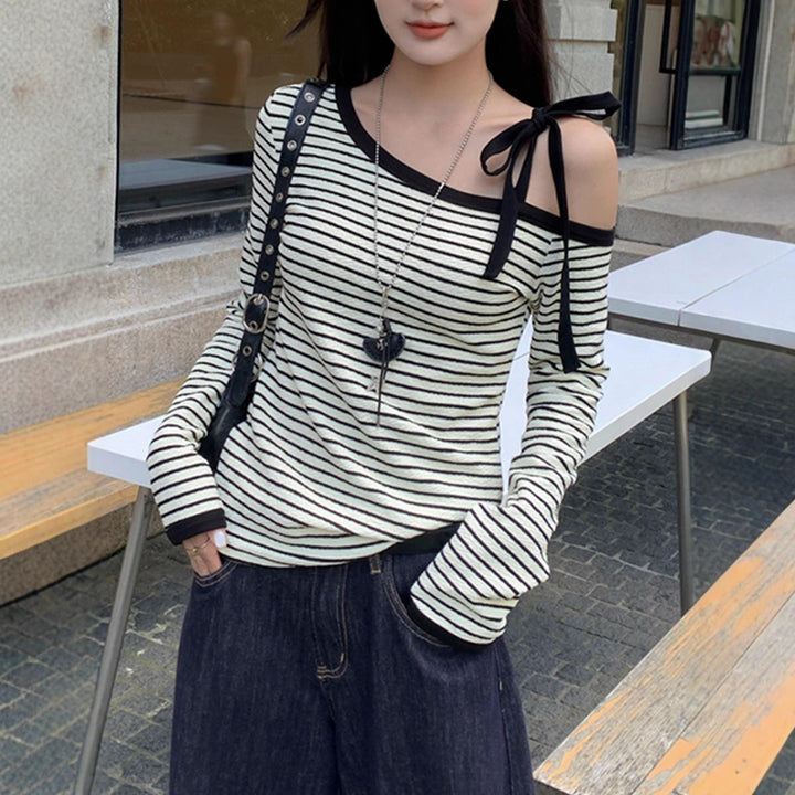 Women's off-shoulder long-sleeve shirt with striped design and decorative bow details Chic & Stil