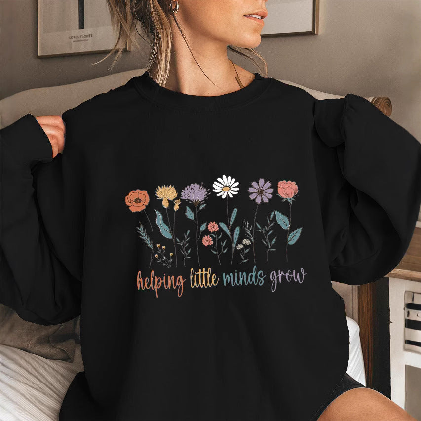 Sweat-shirt femme avec des manches volumineuses et un imprimé floral motivant Chic & Stil