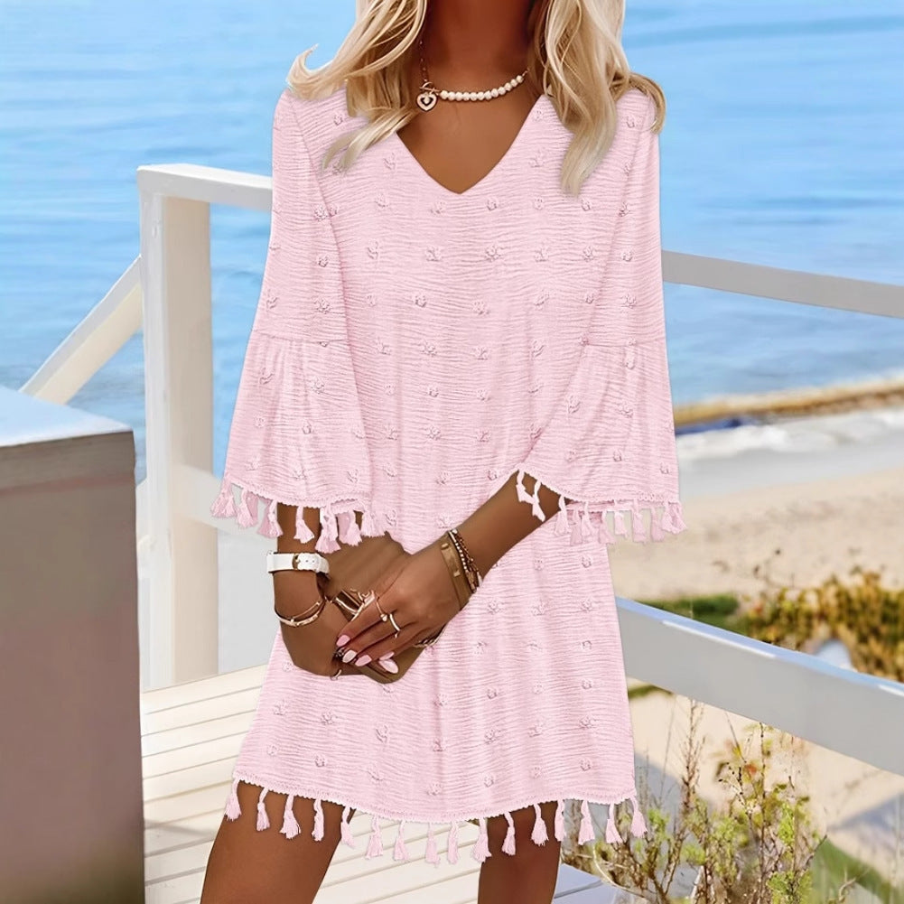 Beach dress for women with an elegant V-neckline and decorative fringes Lune London