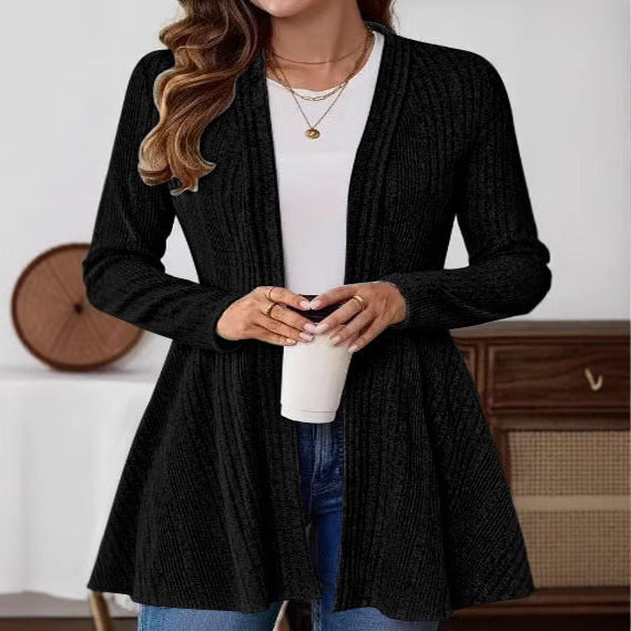 Women’s knitted jacket with a playful design and a chic side belt.