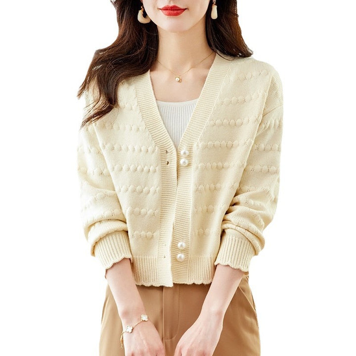 Ladies comfortable knit jacket with pearl adorned buttons and structured design Lune London