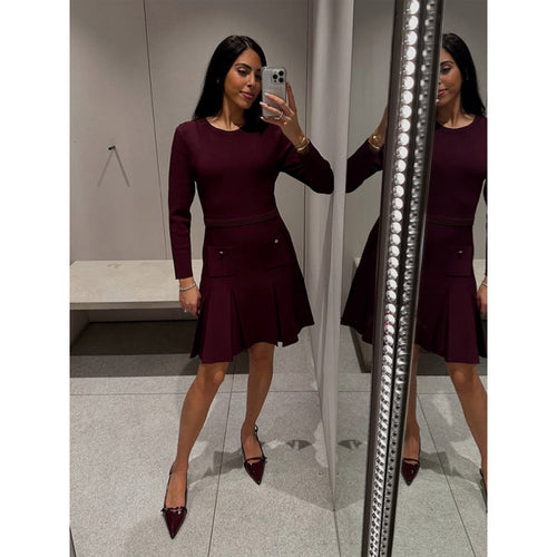 Knitted dress for ladies with decorative button details and practical pockets Lune London