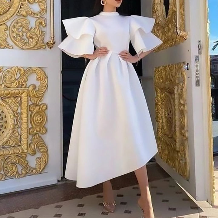 Midi dress for women with voluminous puff sleeves and an asymmetrical hem Lune London