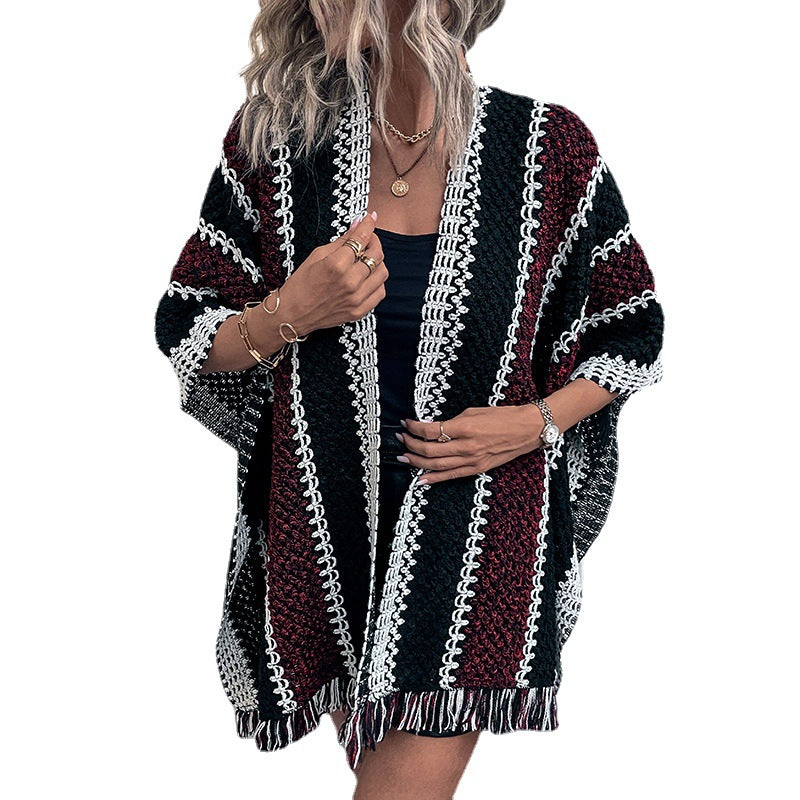 Knit poncho for women with V-neck and fringes Lune London