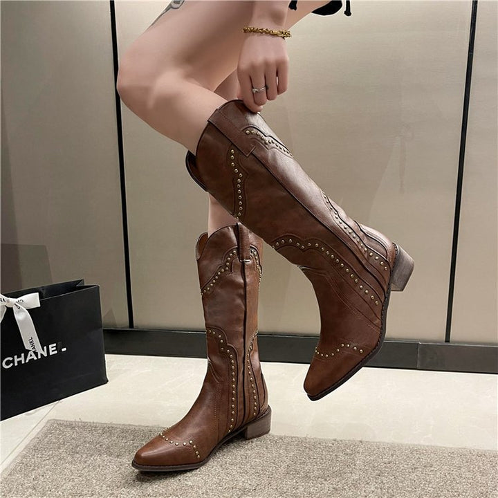 Ladies' cowboy boots with trendy stud accents and a comfortable block heel Lune London