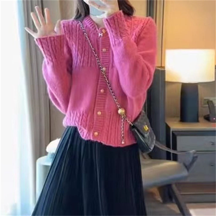 Ladies cozy knit pullover with cable texture and chic gold button details