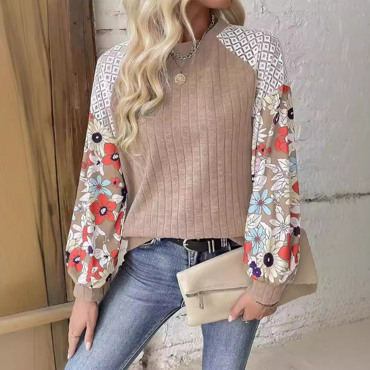 Women's sweater with a playful shape featuring a chic floral sleeve design