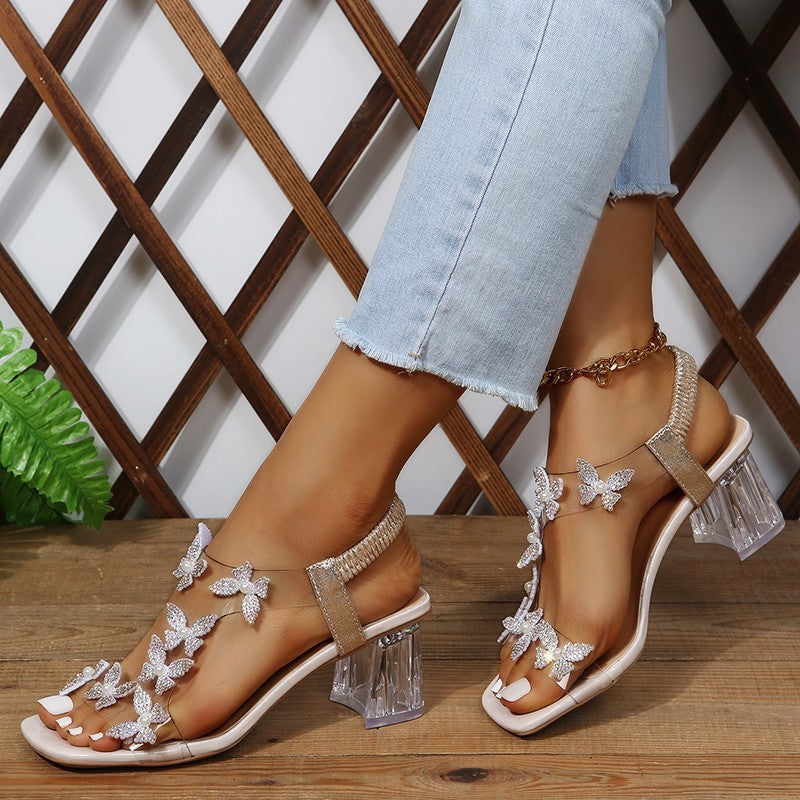 Glamour sandals for ladies with sparkling butterfly details and a transparent block heel Lune London