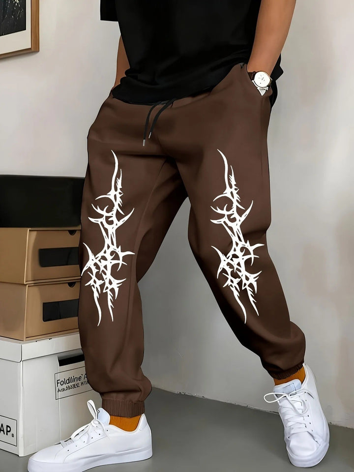 Men's Relaxed Fit Jogging Pants with Eye-Catching Graphic Design Chic & Stil