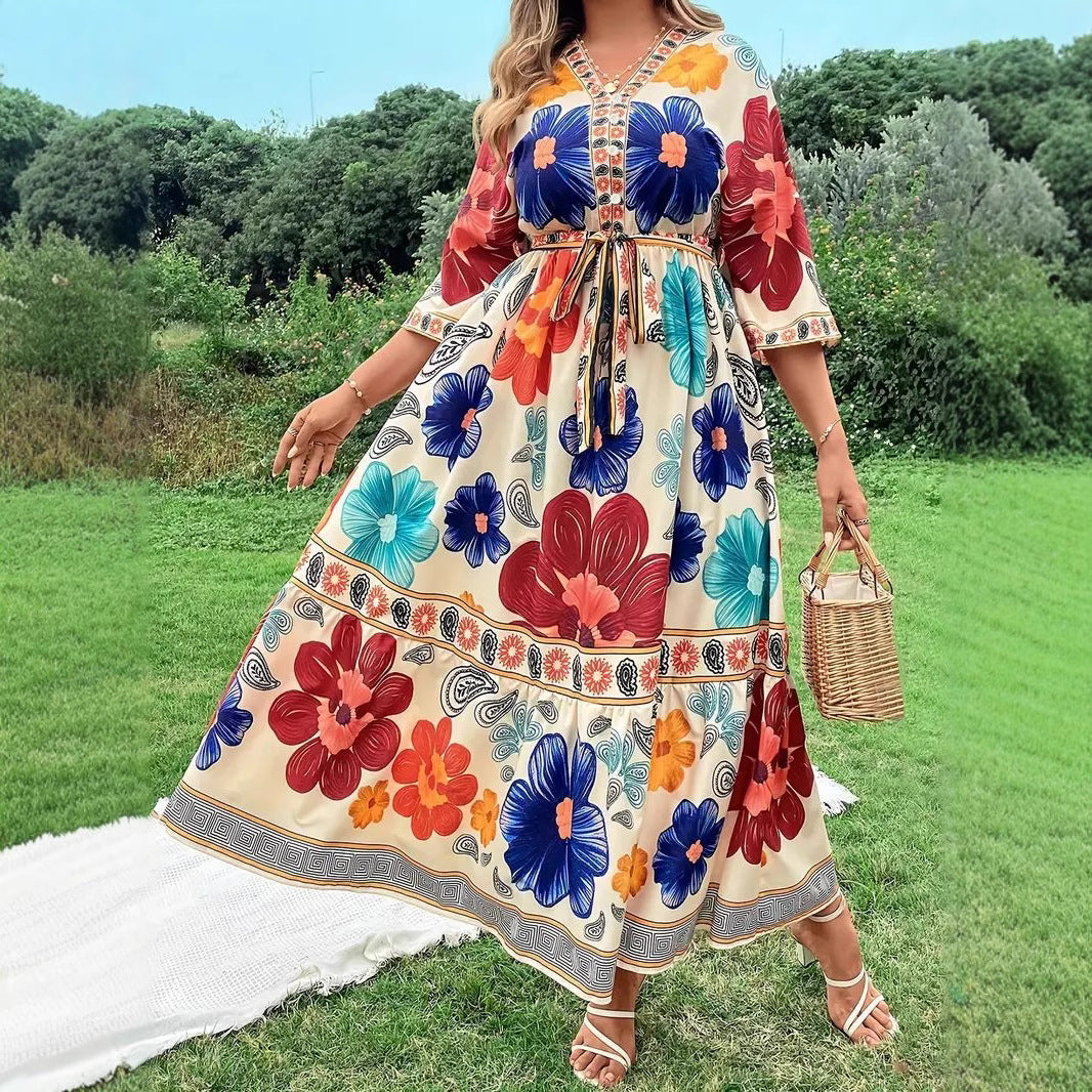 Women's maxi dress with colorful floral design and waist belt Lune London