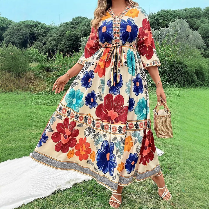 Women's maxi dress with colorful floral design and waist belt Lune London