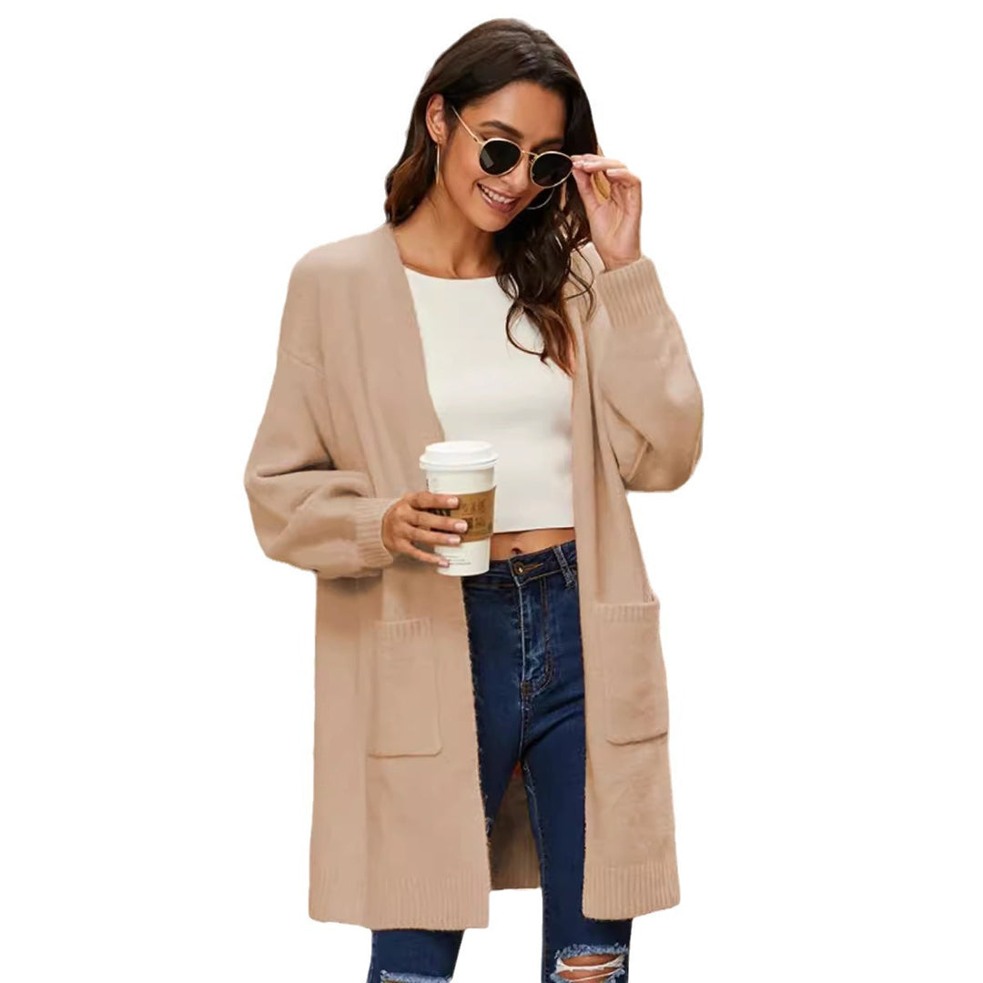 Ladies chunky knit kimono cardigan with open sleeves and practical pockets Lune London