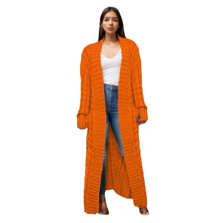 Women Thick knitted cardigan with a refined cable design and practical pockets Lune London