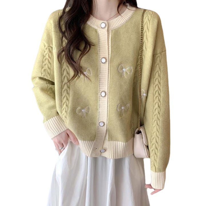 Ladies comfortable knitted cardigan with bow appliqués and a cable pattern Lune London