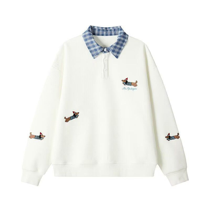 Women's sweater with an elegant checkered pattern and a chic animal print.