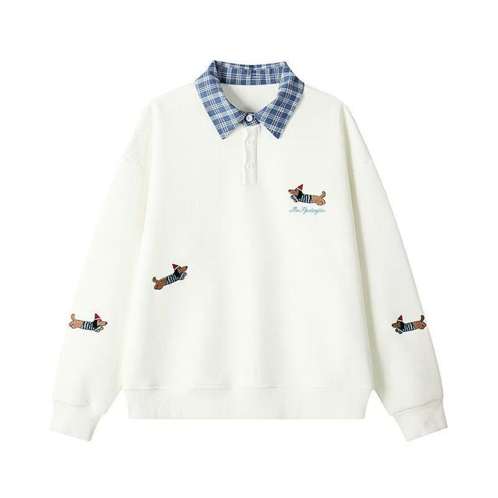 Women's sweater with an elegant checkered pattern and a chic animal print.