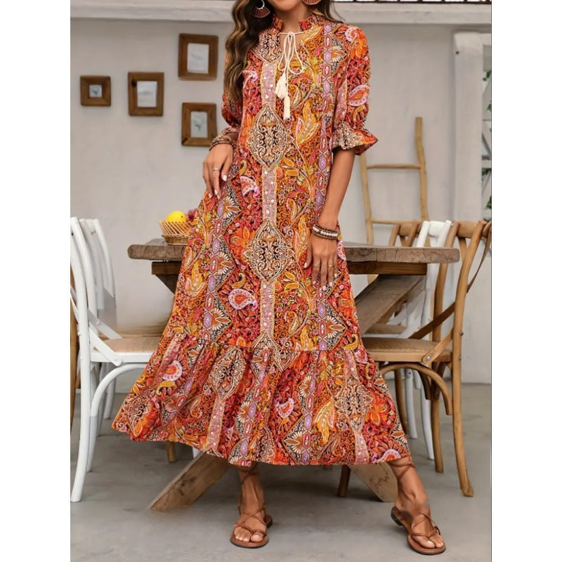 Maxi dress for women with playful paisley pattern and ruffled details Lune London
