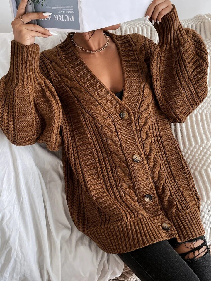 Oversized knitted cardigan for women with an elegant cable pattern and practical buttons Lune London