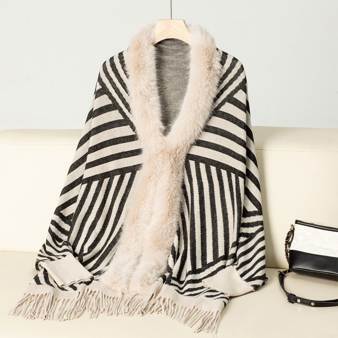 Ladies knitted poncho with elegant faux fur collar and fringe design Lune London