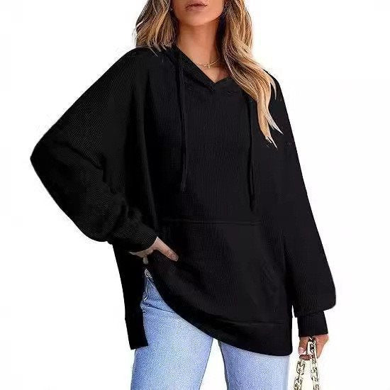 Oversized women's hoodie with side slits and practical pockets Lune London