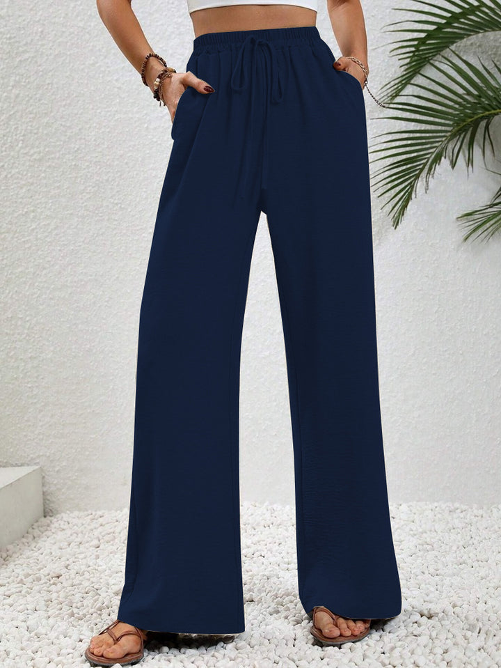 Pantalons larges d'été pour femmes avec taille élastique et poches latérales pratiques Chic & Stil