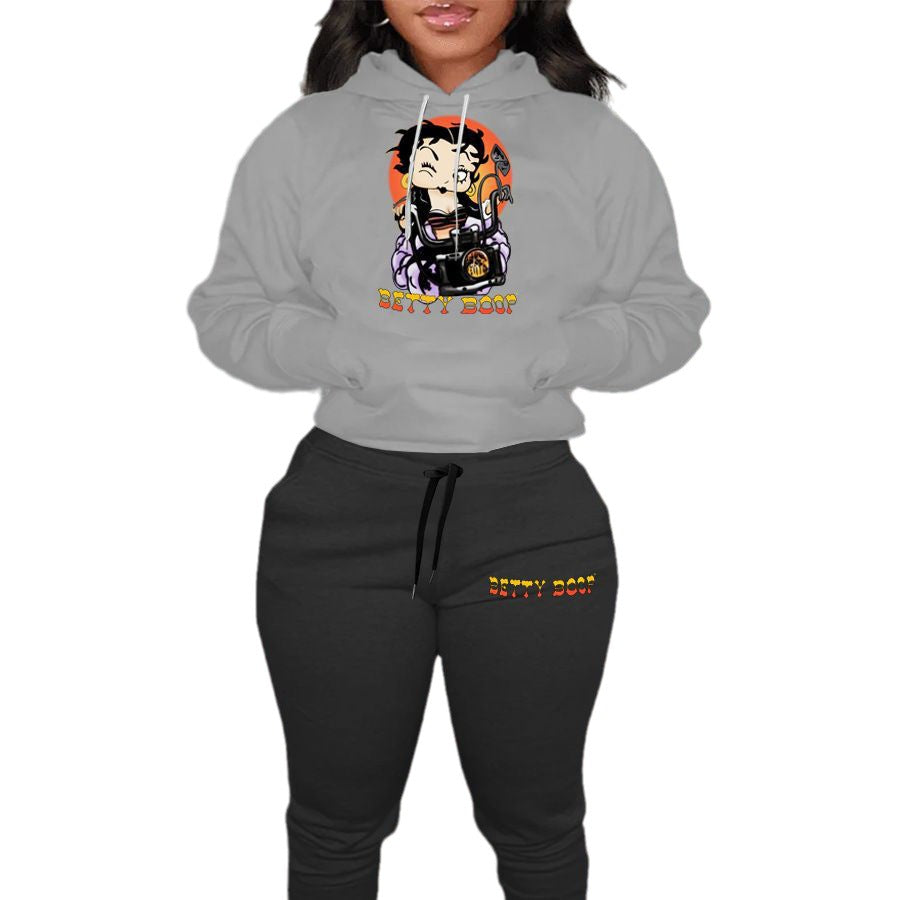Ladies modern outfit hoodie sweater and casual jogger pants with chic cartoon drawing artistic print