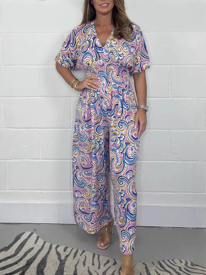 Lady Fluid jumpsuit with elegant paisley pattern and Lune London cinching