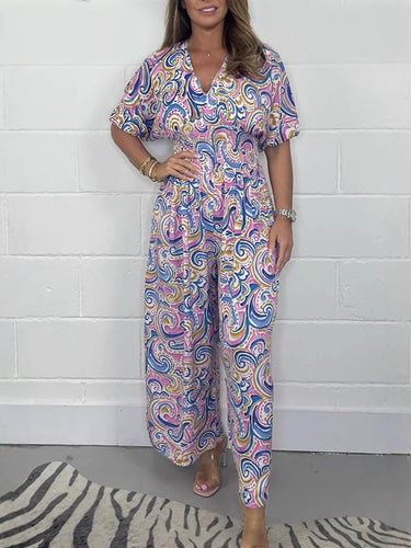 Lady Fluid jumpsuit with elegant paisley pattern and Lune London cinching