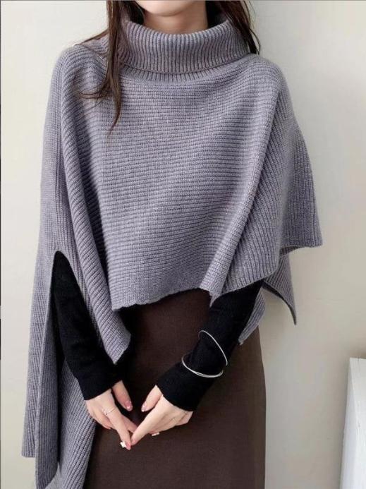 Ladies knitted poncho with high collar and asymmetrical cut Lune London