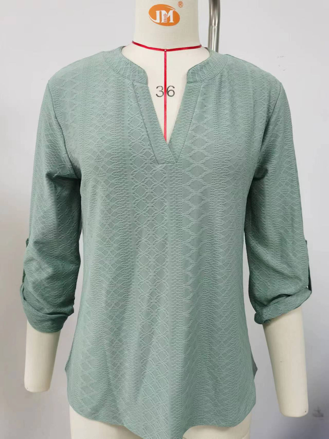 Top woman with V-neck and trendy ruffle details Lune London