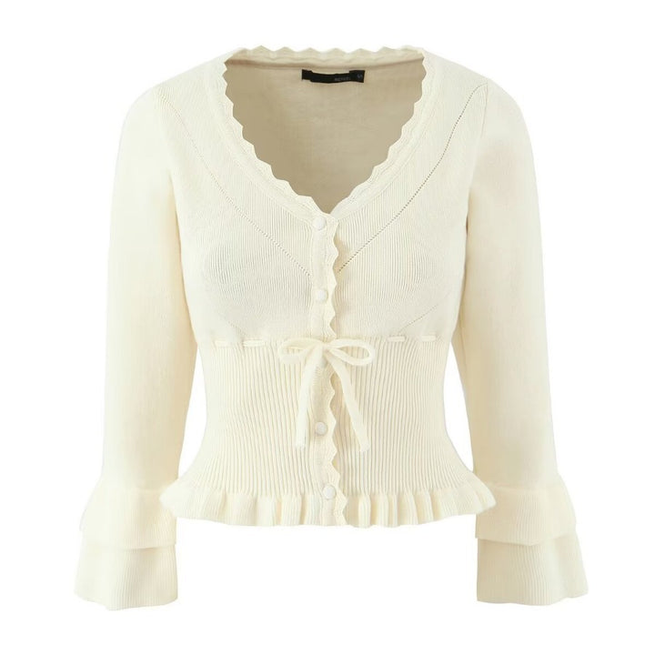 Short sleeve knitted jacket for women with ruffle details and button closure Lune London