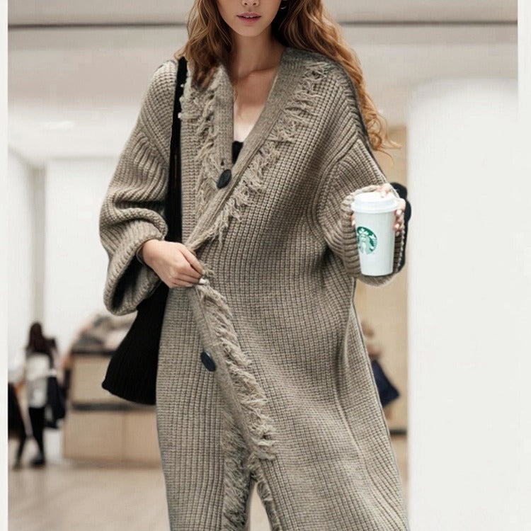 Ladies chunky knitted cardigan with fringed details and an open cut Lune London