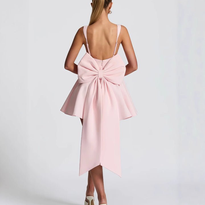 Women's cocktail dress with oversized bow design and flowing skirt Lune London