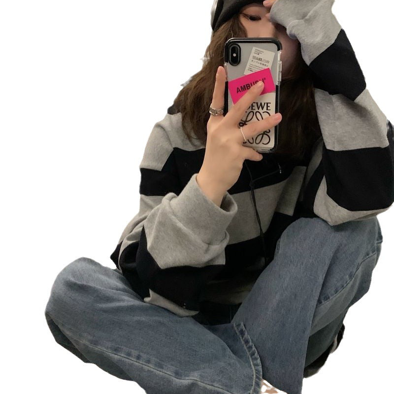 Women's casual knit sweater with wide stripes and cozy oversized fit