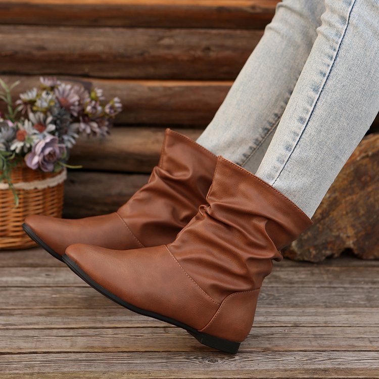 Fashionable women's ankle boots with an elegant ruffle design and a soft upper material Lune London
