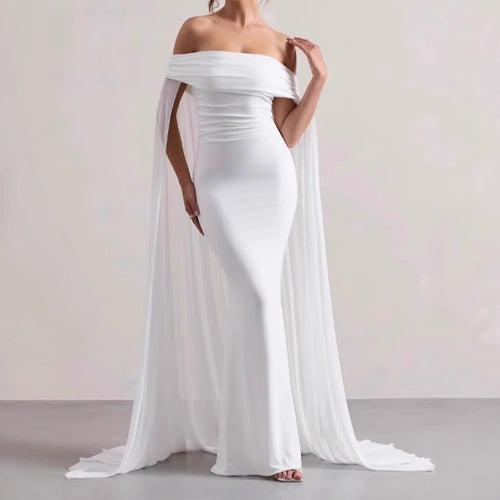 Elegant evening dress for women with off-the-shoulder design, flowing sheer cape, and flattering cut Lune London