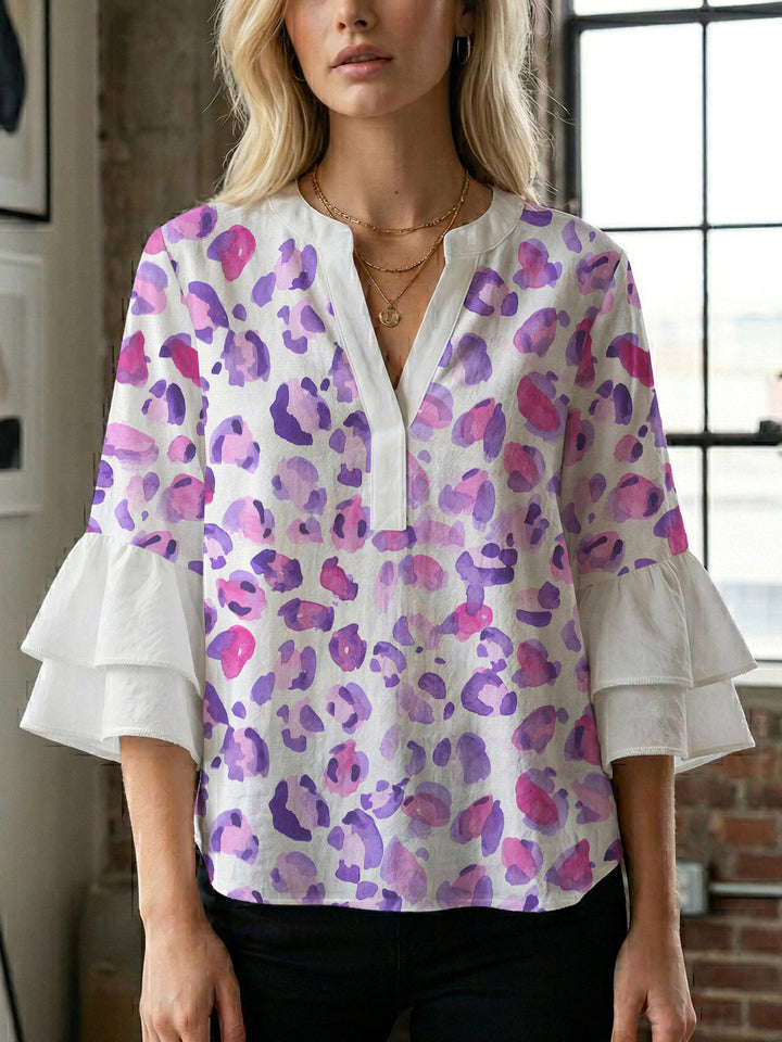 Women's blouse with ruffle details and eye-catching animal print Lune London