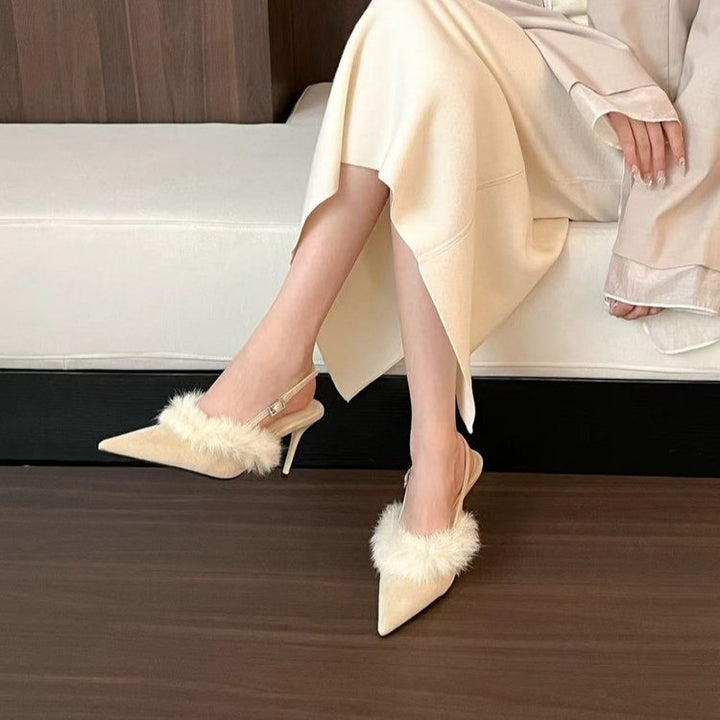 Slingback heeled pumps for ladies with a luxurious fur coating and a chic pointed design.