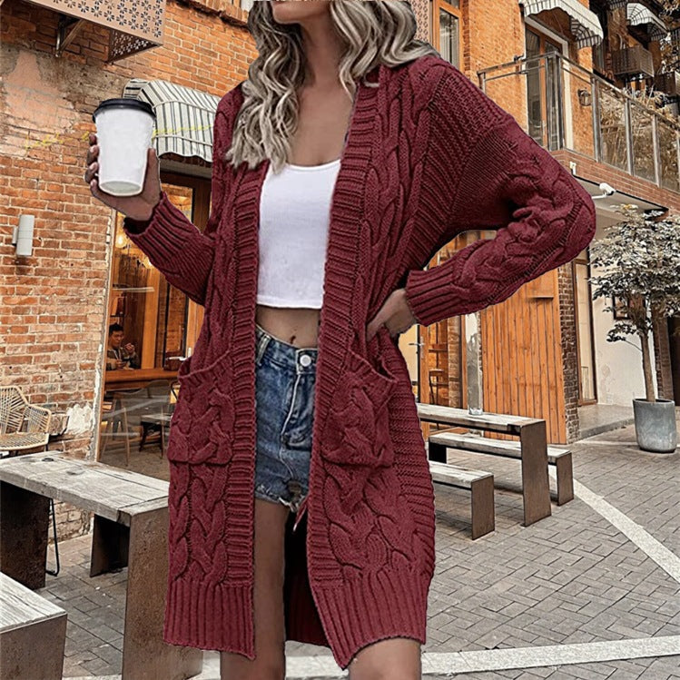 Ladies chunky knit cardigan with deep pockets and elaborate braids design Lune London