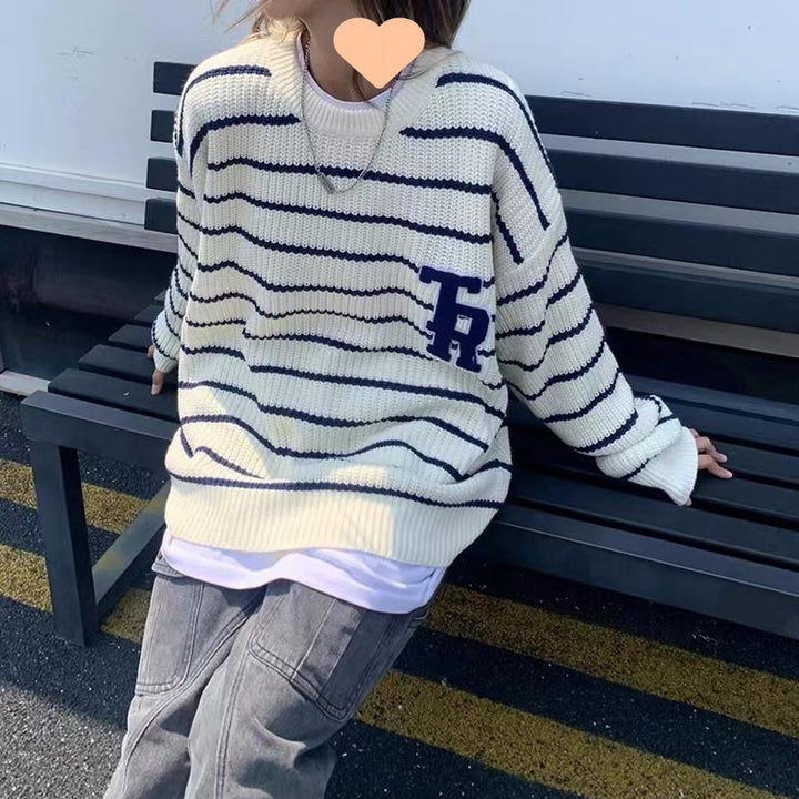Casual oversized knit sweater for women with broken stripes and a chest pocket Lune London
