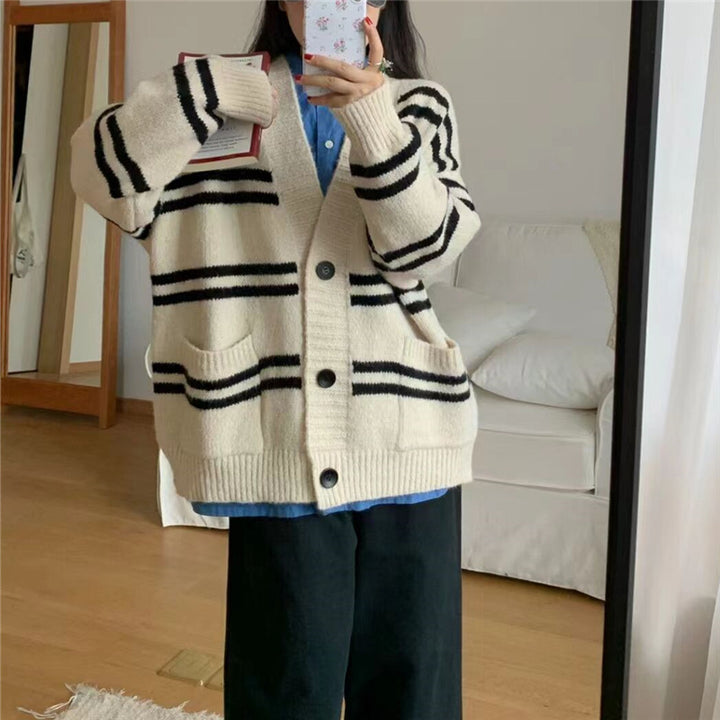 Chunky knit cardigan for women with wide lapels and decorative button details Lune London