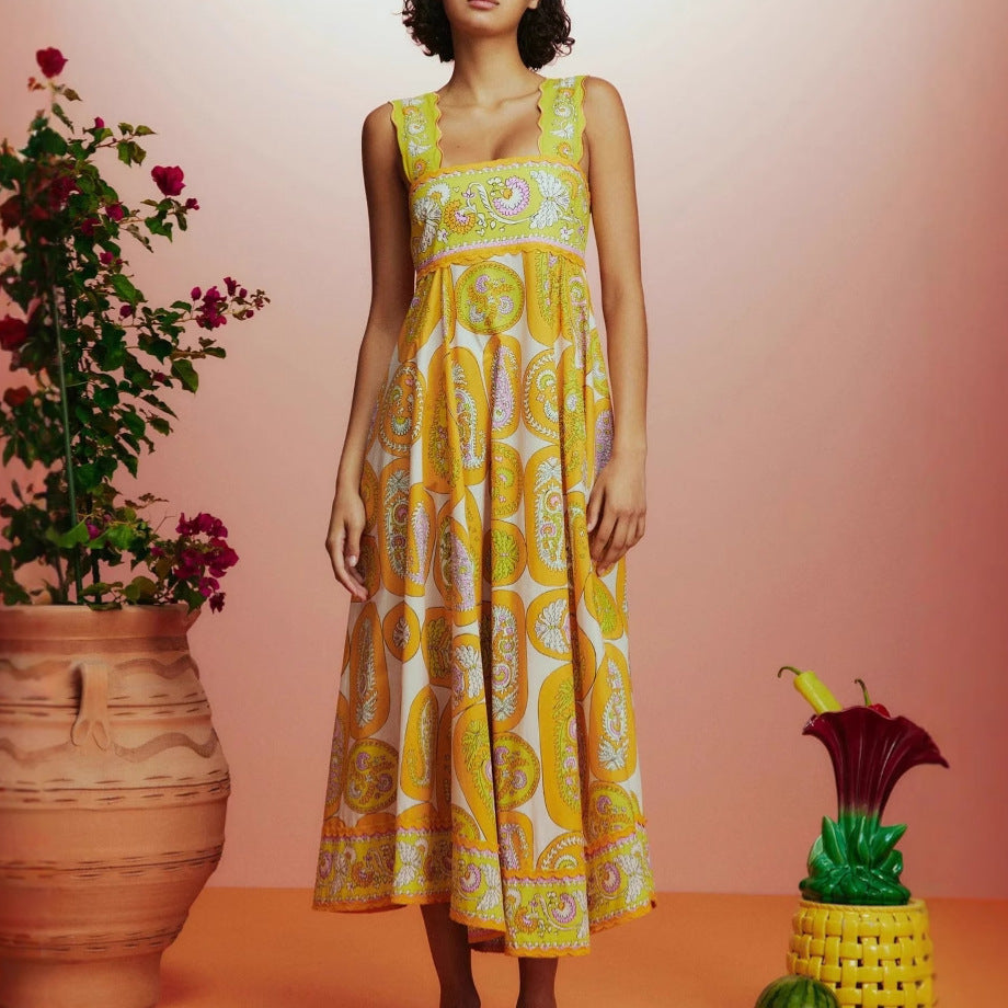 Women's maxi dress with playful paisley design and narrow waist belt Lune London