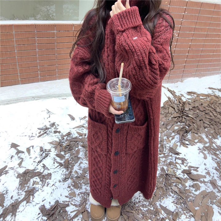 Thick knit button coat for ladies with an elegant cable pattern and practical pockets Lune London
