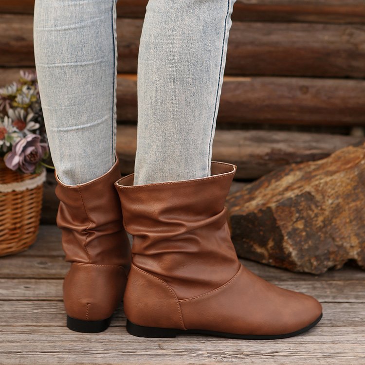 Fashionable women's ankle boots with an elegant ruffle design and a soft upper material Lune London