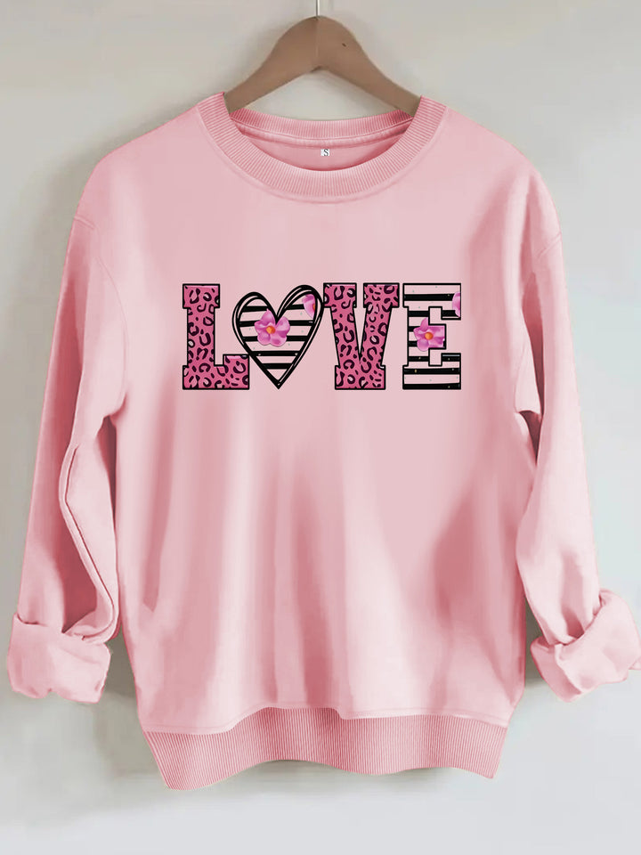 Sweatshirt femme avec design moderne de cœur léopard et coupe confortable Chic & Stil