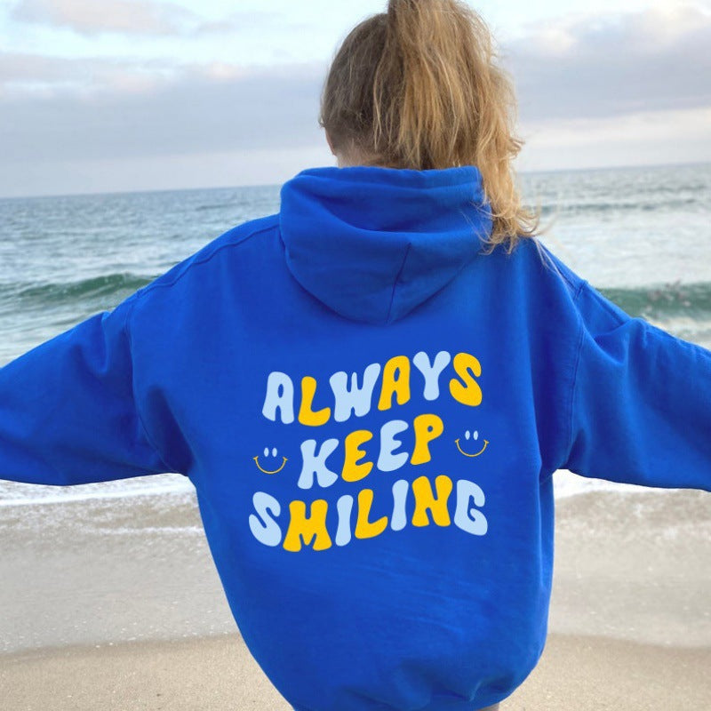 Ladies hoodie with cheerful lettering and practical kangaroo pockets Lune London