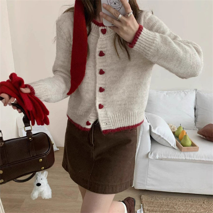 Ladies cozy knit vest with heart-shaped buttons and refined sleeve design Lune London