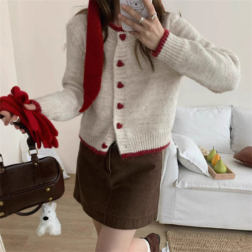 Ladies cozy knit vest with heart-shaped buttons and refined sleeve design Lune London